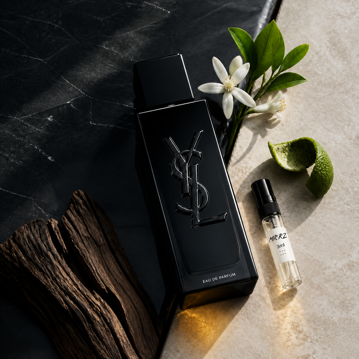 Yves Saint Laurent MYSLF EDP a lahvička vzorku MrRizz na kameni s květem a citrusovou kůrou